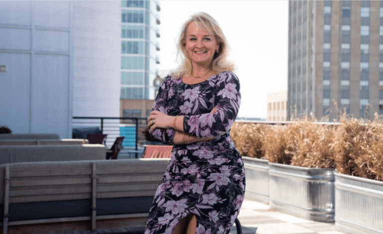 headshot of a women taken on a modern balcony