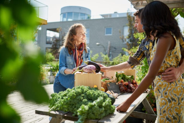 A women buying vegetables from a stand in Pittsboro, NC