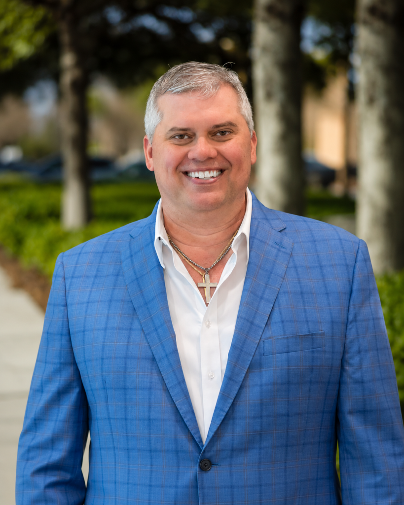 a well dressed man wearing a blue jacket
